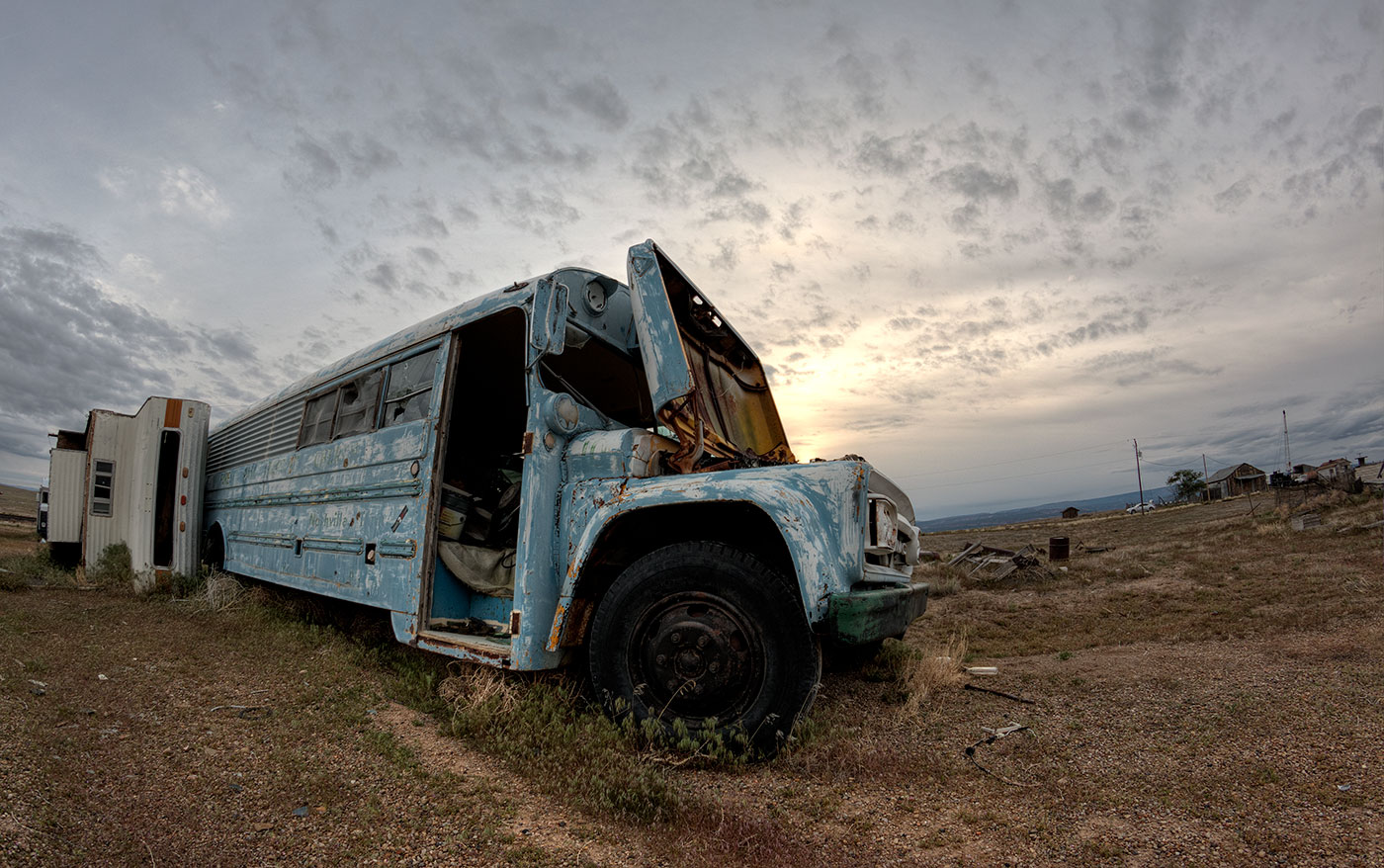 An abandoned blue school  bus in the remains of Cisco, Utah